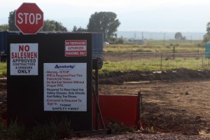Signs outside an old fracking site that was taken down a week ago, on the corner of County Road 13 and Highway 34.  Photo Credit: Chandler Gould 