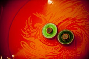 Spinning battling top in an arena during a Beyblade tournament. Photo Credit: Wikimedia Commons