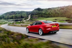 http---image.motortrend.com-f-roadtests-sedans-1409_2016_jaguar_xe_first_look-78775855-2016-jaguar-xe-rear-three-quarter-in-motion