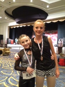 Anya Tkachenko (right) and teammate display their medals. 