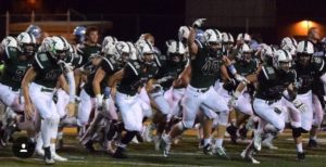 Photo provided by Nick Edrige. Fossil Ridge Football team storms the field. 
