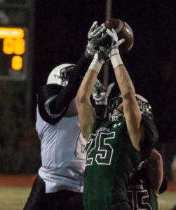 Fossil Ridge senior Ryan Cronin goes up to catch pass from Griffin Roberts. Photo provided by Dennis Johnston 